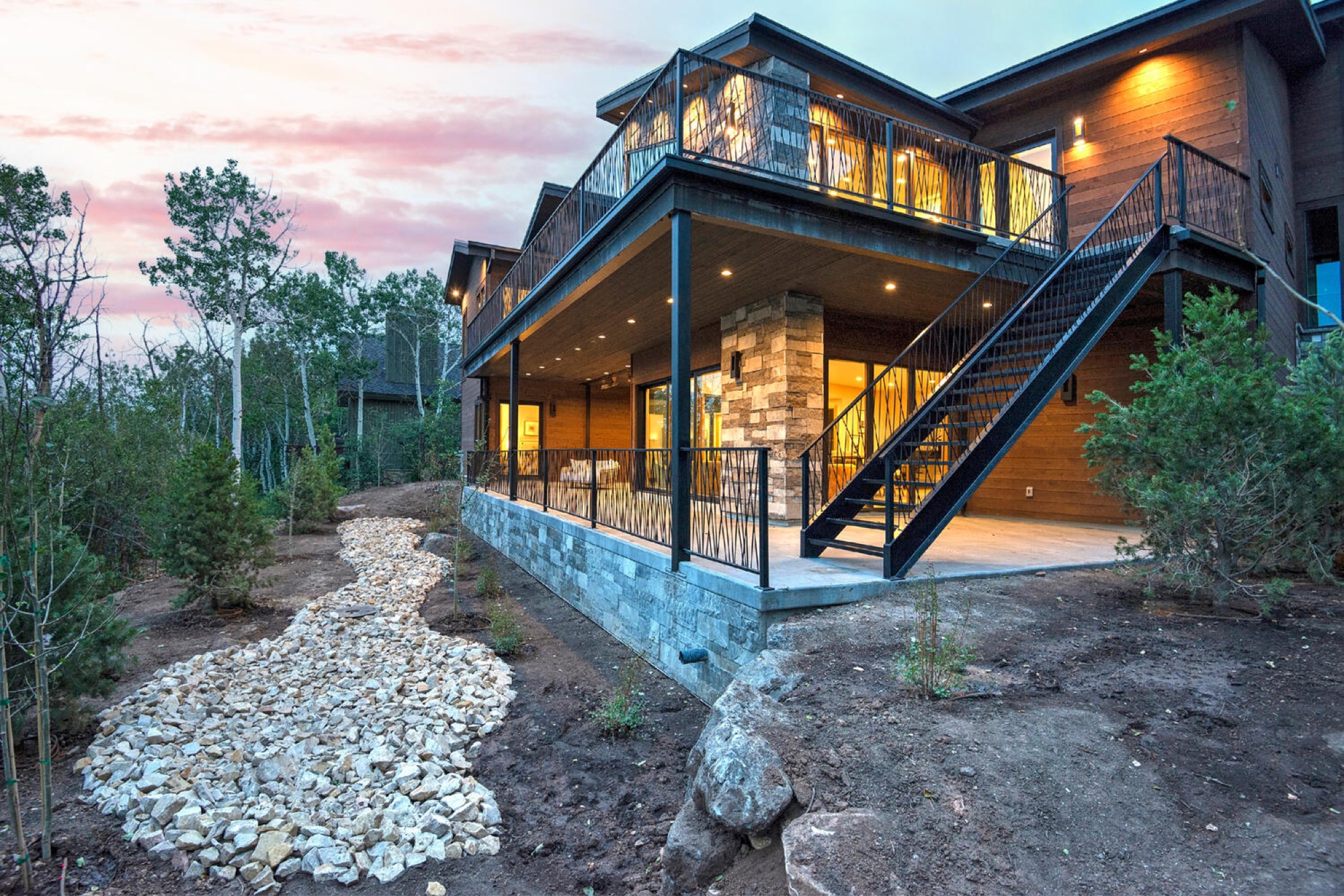 Back exterior of Aspen Springs at dusk
